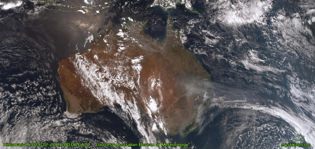 CONTINENT OF FIRE Seen from space, the dark grey plumes of smoke rising from the massive fires in eastern Australia form a grim contrast to the white clouds